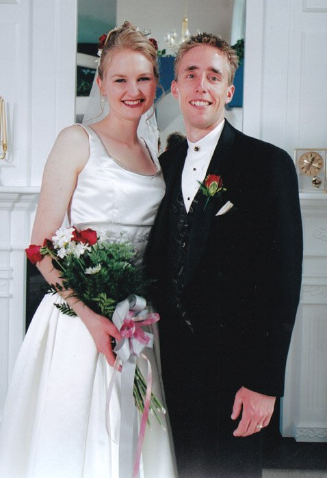 Talena and her husband in a wedding photo.