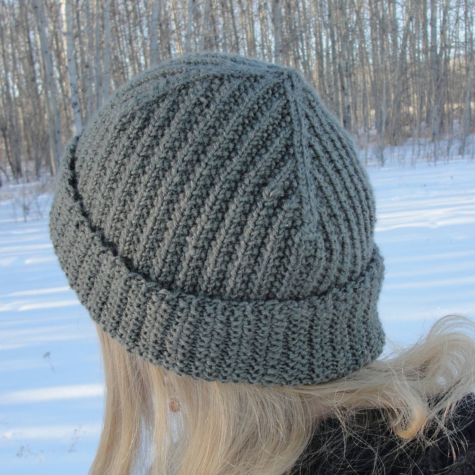 Crown of broken-rib rolled-brim beanie shaped using four raglan shaping decrease pairs.