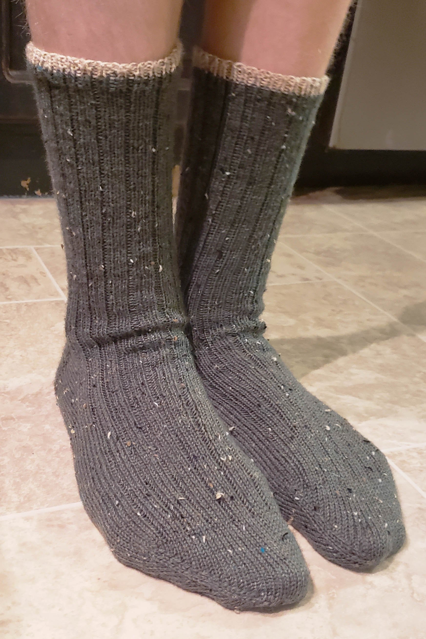 Young man’s feet wearing basic ribbed socks.